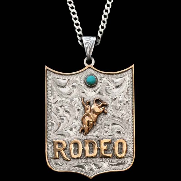 Gift your Rodeo Athlete with the Rodeo Badge Custom Pendant. Crafted on a hand-engraved, German Silver base. Detailed with your choice of German Silver lettering and a straight-edge border. Customize with your choice of figure, cubic zirconia stones and l